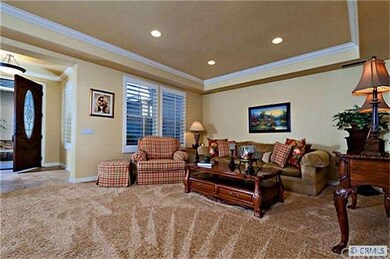 Spacious Living Room with trey ceiling, crown mold