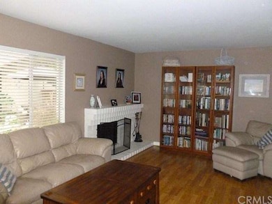 Large family room has laminate floors and romantic