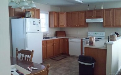 Eat-in kitchen with access to back deck