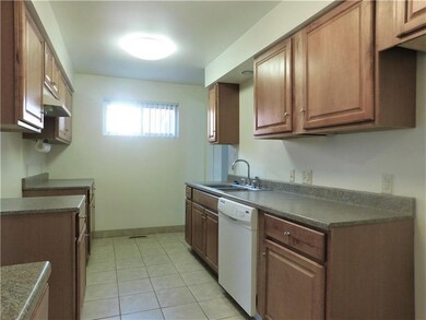 The newer oak kitchen features newer oak cabinets 