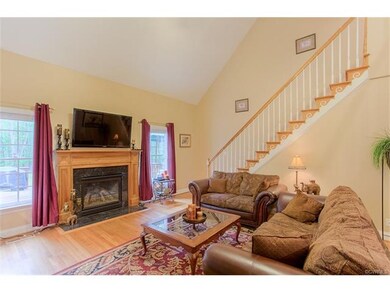 Vaulted Family Room has hardwood floors, gas firep