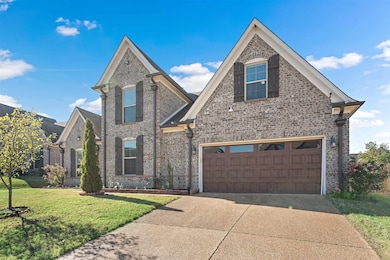 View of front of property featuring a garage and a