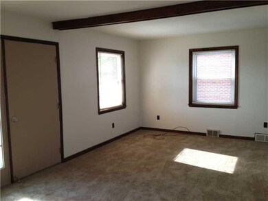 Living Room. Brand new carpet and newer windows.