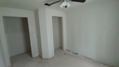 Unfurnished bedroom featuring a ceiling fan