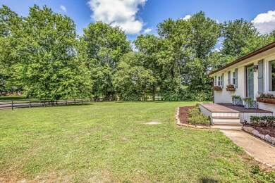 COME UP THE STEPS TO YOUR SUNNY AND SPACIOUS FRONT PORCH 