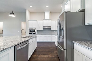 Home under construction. Photos of completed home of same floor plan.