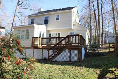 Rear view of the home with the newer dimensional r