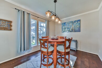 Alternate view of dining, showcasing large window.