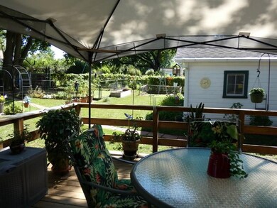 Covered deck overlooks Spacious Yard with Mature T