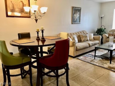 Dining space featuring a chandelier and light tile patterned floors