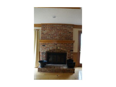 Charming brick fireplace in the Great Room.