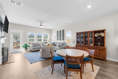 Dining area with a glass covered fireplace, visibl