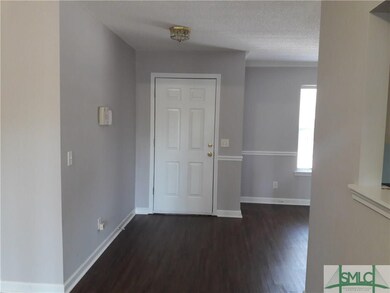 entry area shows off the new vinyl plank flooring 