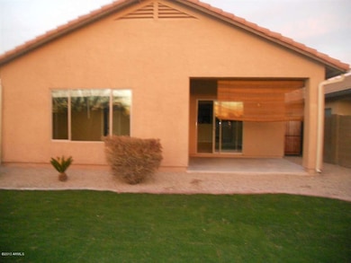 Back of house with patio