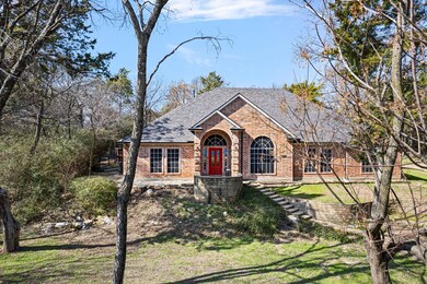 View of front of house with brick siding, a front 
