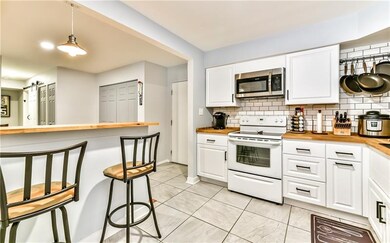 The kitchen wall has been opened up to provide a b