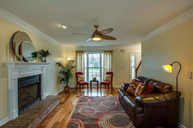 Spacious Living Room with fireplace. Hardwoods throughout downstairs. 