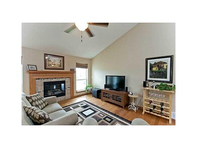 Living Room. Open plan with gas fireplace & vaulte