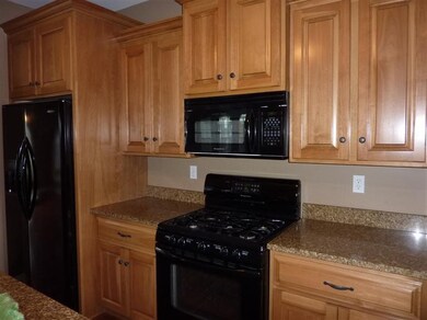 Bruder custom kitchen with granite counters.