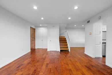 Unfurnished living room featuring visible vents, r