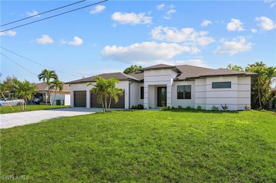View of front of home featuring stucco siding, dri