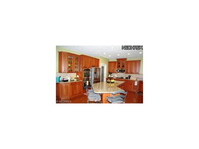 Gourmet Kitchen w/ hardwood flooring, granite coun