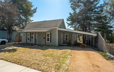 View of front of property featuring roof with shin
