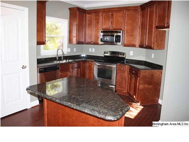 GORGEOUS GRANITE COUNTERTOPS IN KITCHEN WITH ISLAN