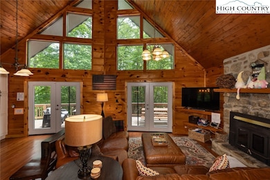 Wall of windows to wooded view