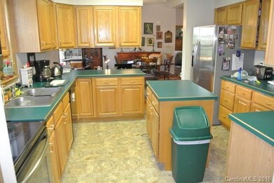 Kitchen with island and stainless appliances