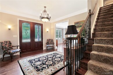 Welcoming foyer with double mahagony doors with le
