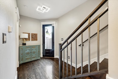 Light-filled foyer with modern geometric ceiling f