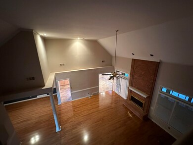 Living room featuring ceiling fan, hardwood / wood