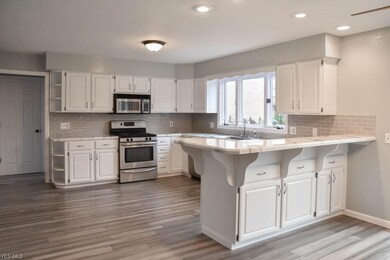 Updated kitchen with tons of cabinet space and sta