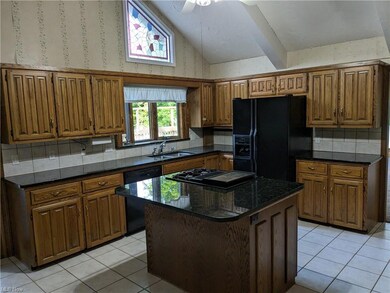Kitchen with custom cabinets & granite tops