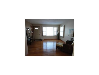 Living Room. Gleaming hardwood floors and open to 