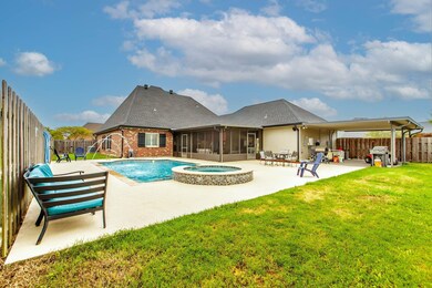 Features pool, boat port,California style garage, Screened party room/patio with bar area . All overlooking the pool.