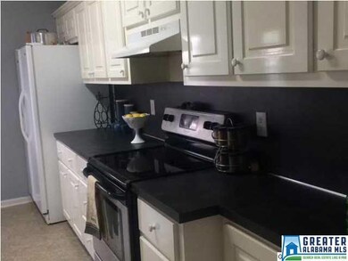 Large kitchen has plenty of counter space and cabi
