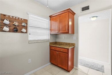 Kitchen featuring baseboards, light tile patterned