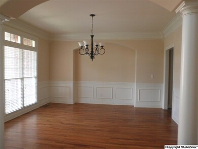 From the foyer, the formal dining room is to your left with HW floors and lots of trim detail.