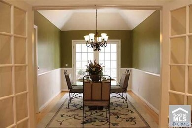 French doors open into your formal dining room wit