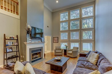 Balcony overlooks spacious living area featuring 1