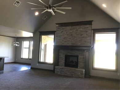 Living area has cathedral ceiling, large windows, 
