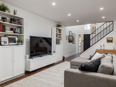 Living room with recessed lighting, stairs, and d