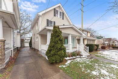 Driveway leads to the 2-car detached garage and fully fenced in backyard