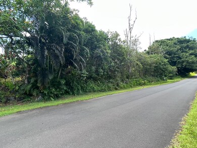 Paved road fronting lot.