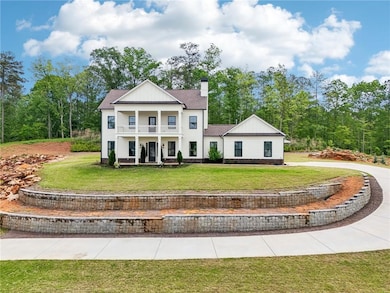 Greek revival house featuring board and batten sid