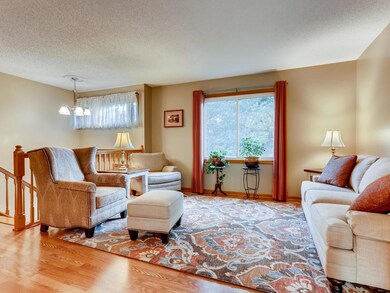 The living room features a large window overlookin
