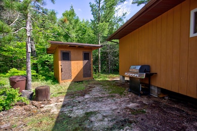 View of yard with a storage shed