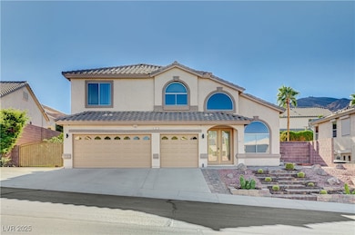 Mediterranean / spanish home with a garage, stucco siding, concrete driveway, and a tiled roof